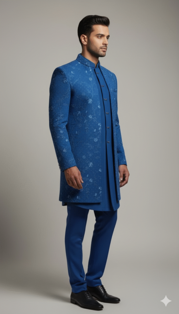 Teal blue Indo-Western set featuring intricate embroidery, paired with matching trousers, designed for festive and wedding occasions.