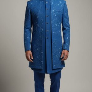 Teal blue Indo-Western set featuring intricate embroidery, paired with matching trousers, designed for festive and wedding occasions.