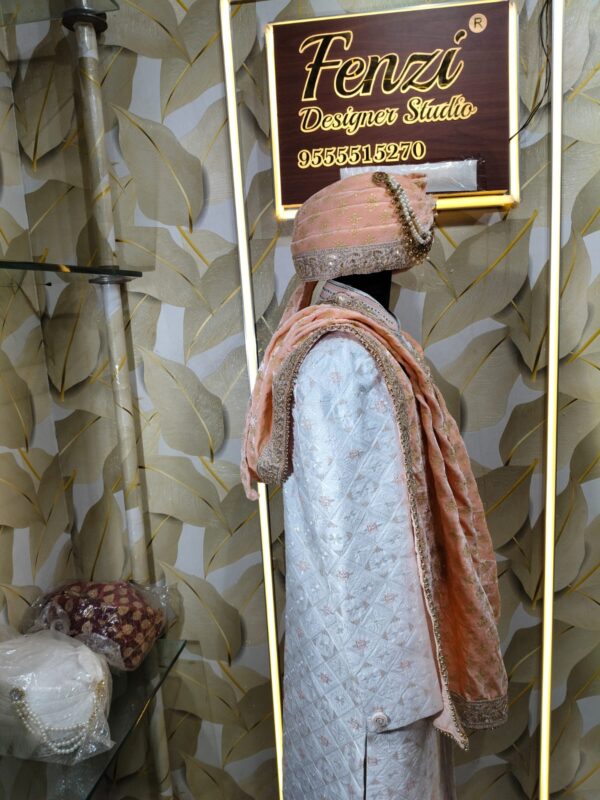 Elegant peach and silver embroidered sherwani with matching turban and stole displayed at Fenzi Designer Studio.