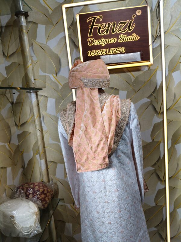 Elegant peach and silver embroidered sherwani with matching turban and stole displayed at Fenzi Designer Studio.