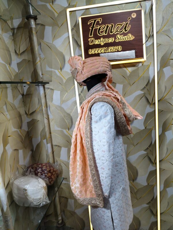 Elegant peach and silver embroidered sherwani with matching turban and stole displayed at Fenzi Designer Studio.