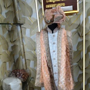 Elegant peach and silver embroidered sherwani with matching turban and stole displayed at Fenzi Designer Studio.