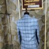 Light blue checked blazer displayed on mannequin at Fenzi Designer Studio.