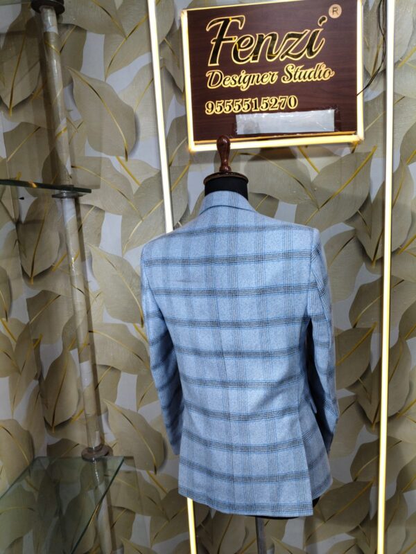 Light blue checked blazer displayed on mannequin at Fenzi Designer Studio.