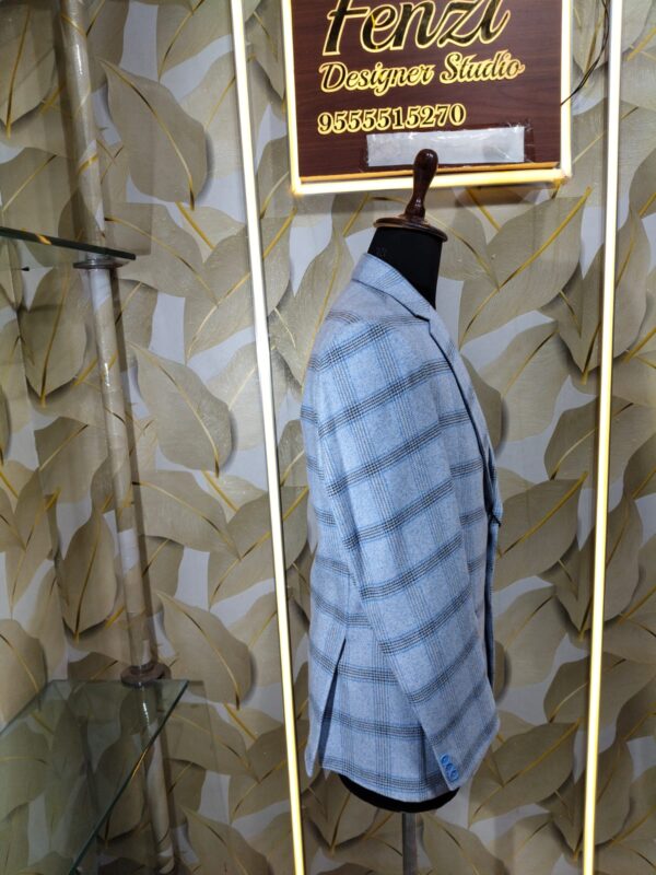 Light blue checked blazer displayed on mannequin at Fenzi Designer Studio.