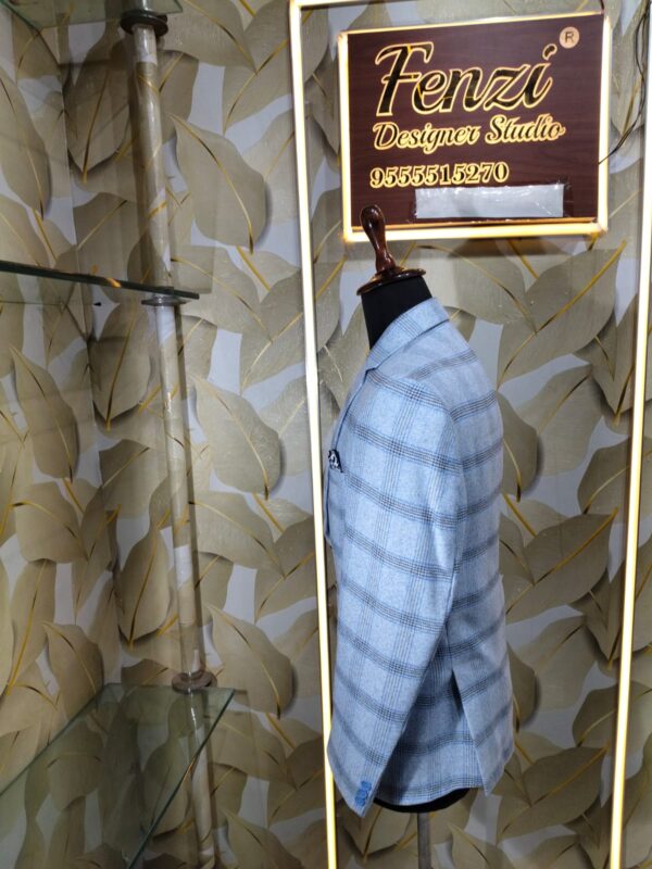 Light blue checked blazer displayed on mannequin at Fenzi Designer Studio.