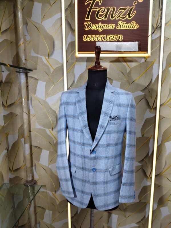 Light blue checked blazer displayed on mannequin at Fenzi Designer Studio.