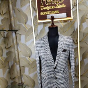 Elegant houndstooth designer blazer displayed at Fenzi Designer Studio.