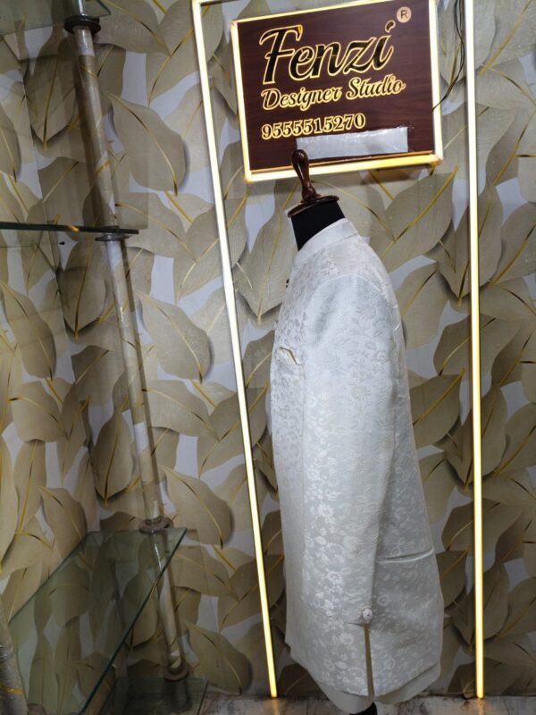Elegant white designer sherwani with intricate embroidery