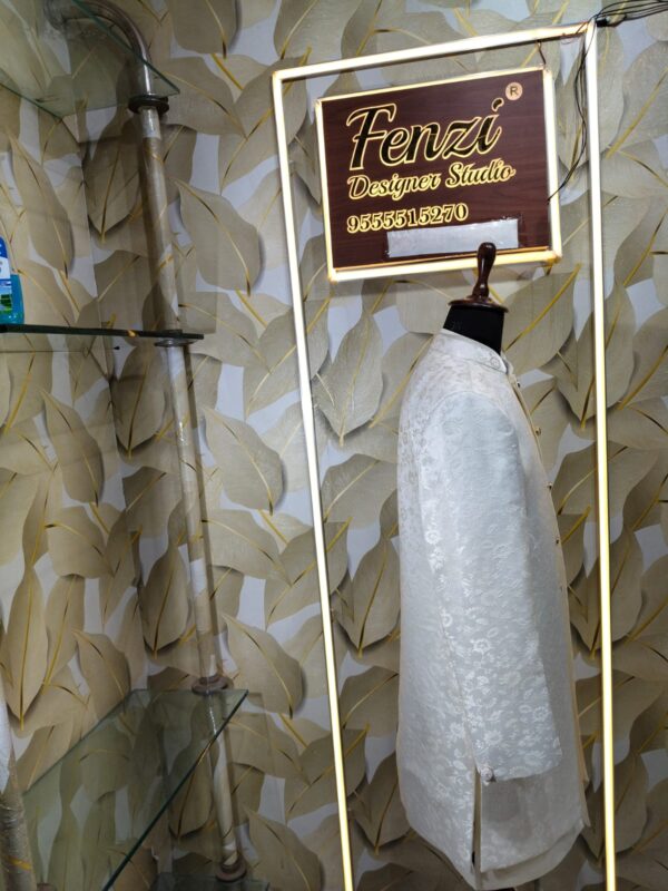 Elegant white designer sherwani with intricate embroidery