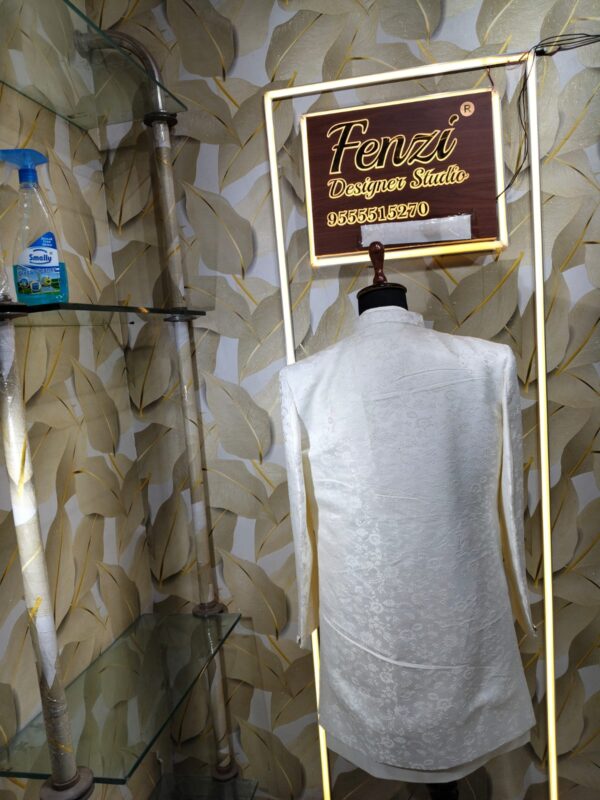 Elegant white designer sherwani with intricate embroidery