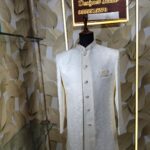 Elegant white designer sherwani with intricate embroidery
