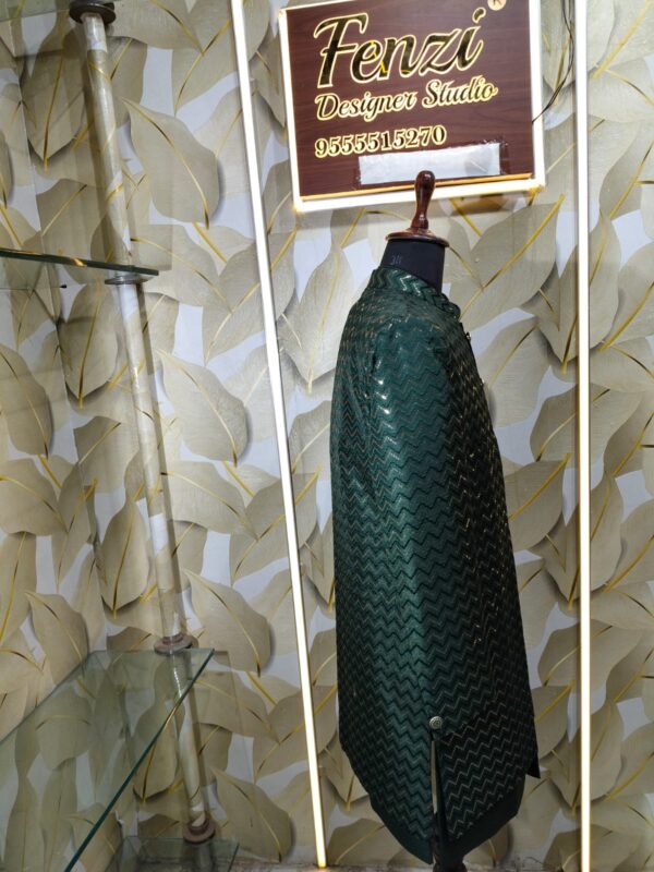 Dark green designer sherwani with zigzag pattern and golden buttons displayed