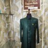 Dark green designer sherwani with zigzag pattern and golden buttons displayed