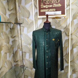 Dark green designer sherwani with zigzag pattern and golden buttons displayed