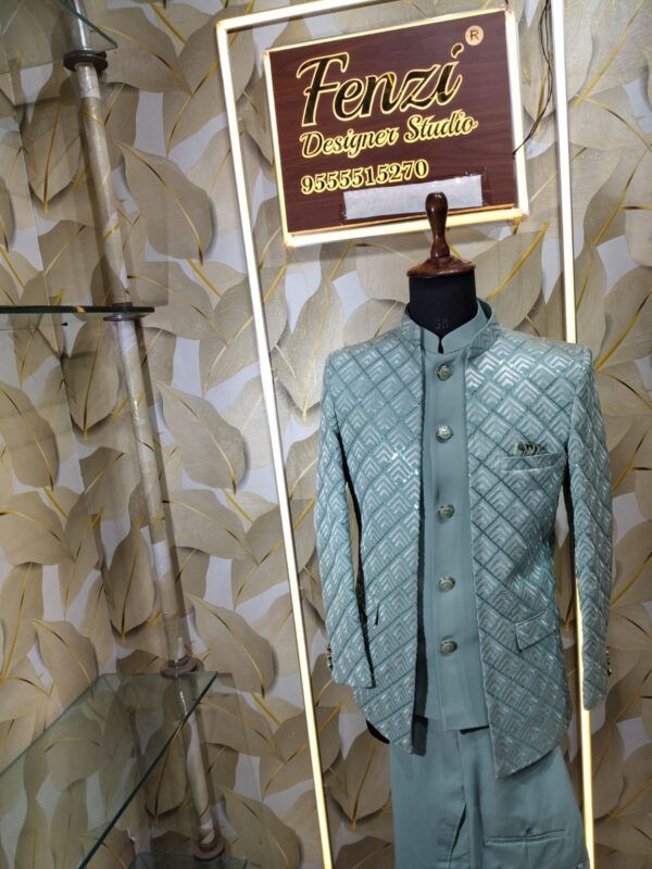 Elegant pastel green embroidered men’s designer sherwani displayed on a mannequin at Fenzi Designer Studio.
