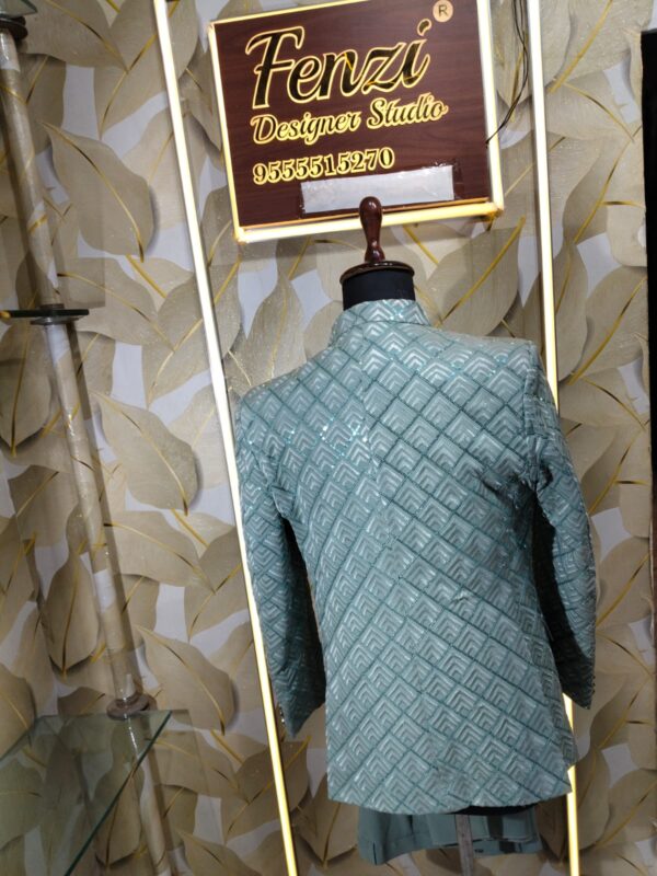 Elegant pastel green embroidered men’s designer sherwani displayed on a mannequin at Fenzi Designer Studio.