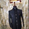 Elegant black designer Jodhpuri with textured geometric pattern and metallic buttons displayed on a mannequin at Fenzi Designer Studio.