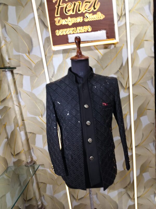 Elegant black designer Jodhpuri with textured geometric pattern and metallic buttons displayed on a mannequin at Fenzi Designer Studio.