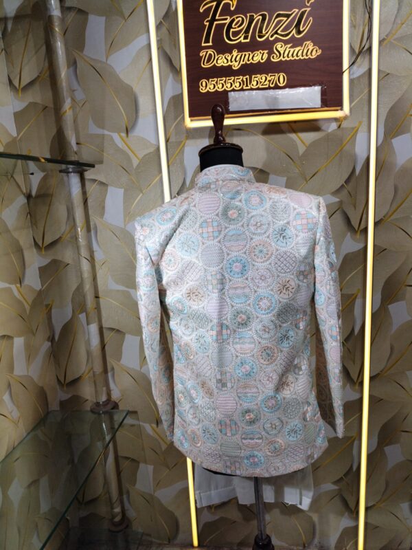 Pastel embroidered Jodhpuri suit displayed on a mannequin at Fenzi Designer Studio.