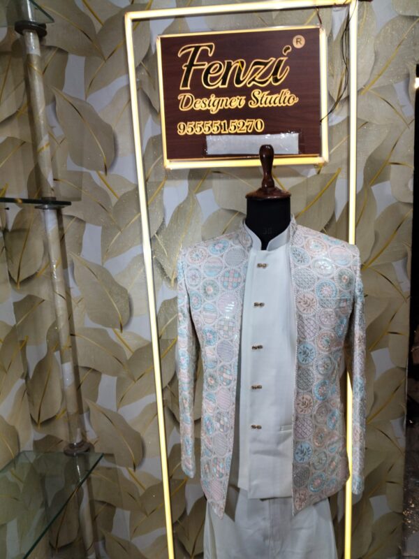 Pastel embroidered Jodhpuri suit displayed on a mannequin at Fenzi Designer Studio.