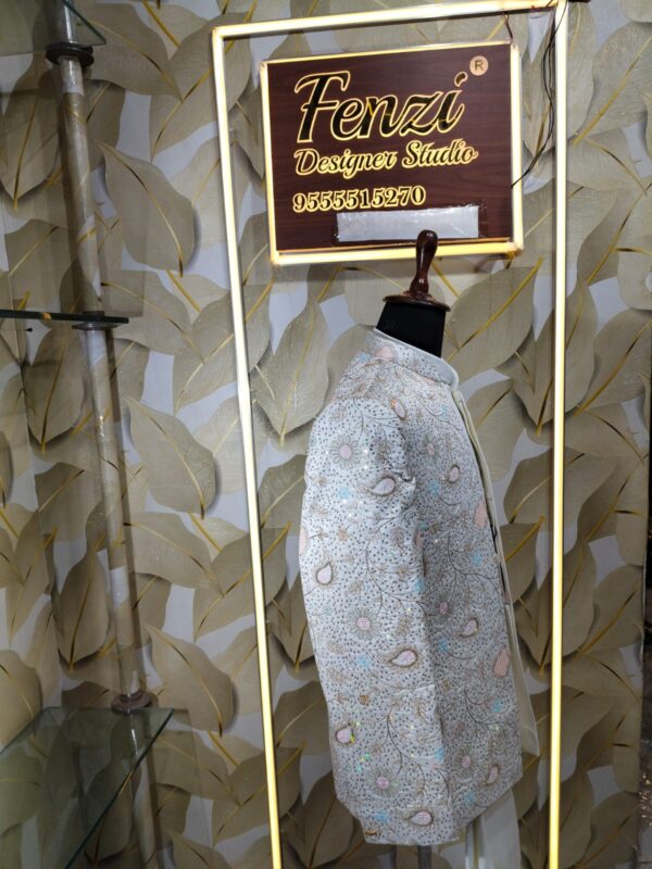 “Pastel embroidered Jodhpuri suit displayed on a mannequin at Fenzi Designer Studio
