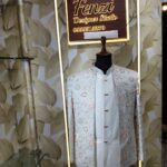 “Pastel embroidered Jodhpuri suit displayed on a mannequin at Fenzi Designer Studio