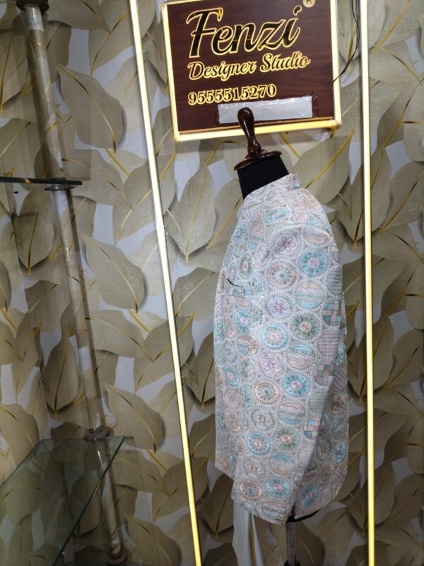 Pastel embroidered Jodhpuri suit displayed on a mannequin at Fenzi Designer Studio.