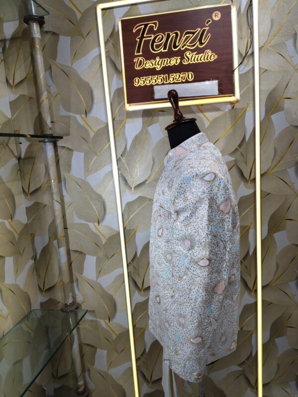 “Pastel embroidered Jodhpuri suit displayed on a mannequin at Fenzi Designer Studio