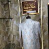 “Pastel floral embroidered Jodhpuri suit displayed on a mannequin at Fenzi Designer Studio.”