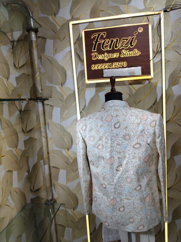 “Pastel embroidered Jodhpuri suit displayed on a mannequin at Fenzi Designer Studio