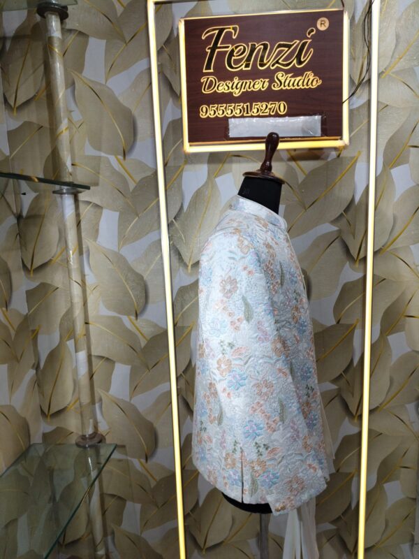 “Pastel floral embroidered Jodhpuri suit displayed on a mannequin at Fenzi Designer Studio.”
