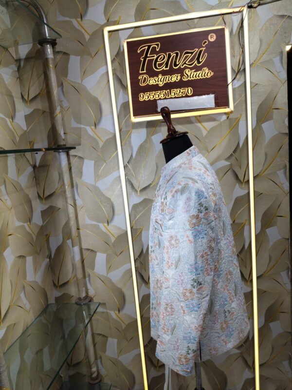 “Pastel floral embroidered Jodhpuri suit displayed on a mannequin at Fenzi Designer Studio.”