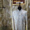 “Pastel floral embroidered Jodhpuri suit displayed on a mannequin at Fenzi Designer Studio.”