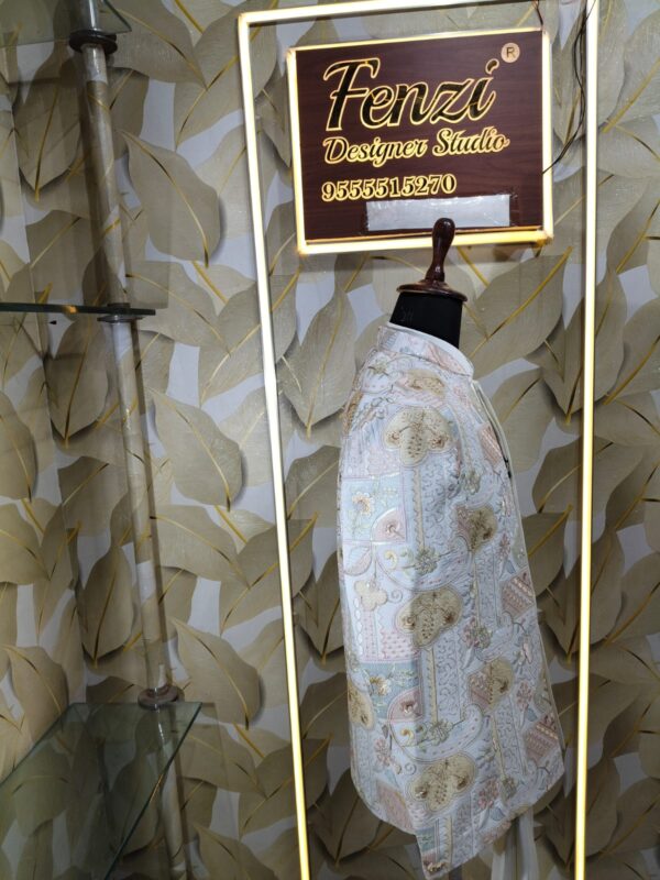 Pastel embroidered Jodhpuri suit displayed on a mannequin at Fenzi Designer Studio