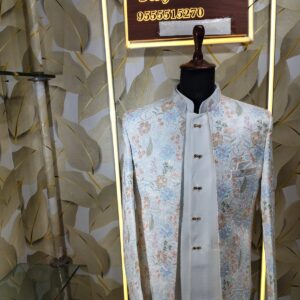 “Pastel floral embroidered Jodhpuri suit displayed on a mannequin at Fenzi Designer Studio.”