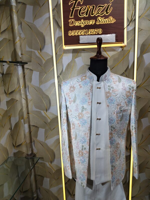 “Pastel floral embroidered Jodhpuri suit displayed on a mannequin at Fenzi Designer Studio.”