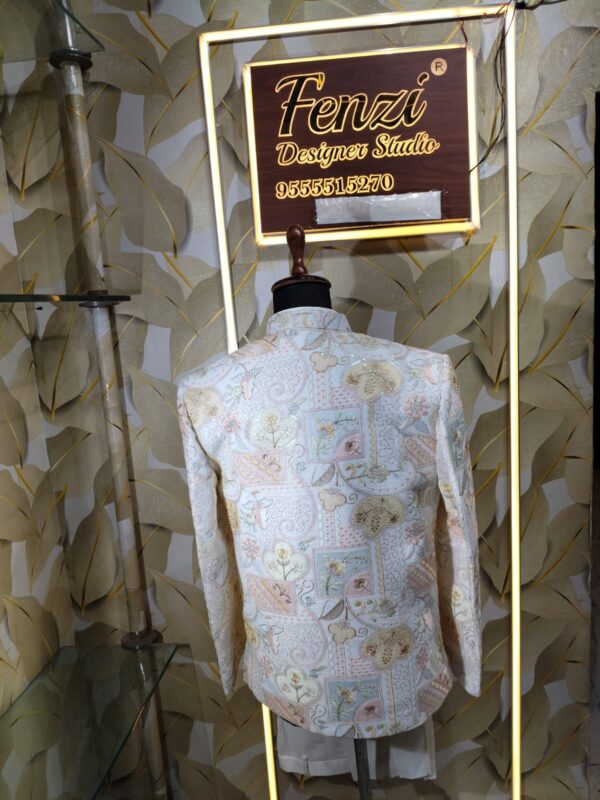 Pastel embroidered Jodhpuri suit displayed on a mannequin at Fenzi Designer Studio