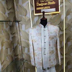 Pastel embroidered Jodhpuri suit displayed on a mannequin at Fenzi Designer Studio