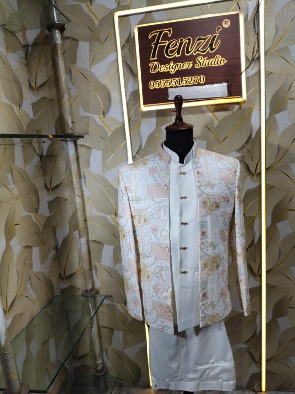 Pastel embroidered Jodhpuri suit displayed on a mannequin at Fenzi Designer Studio