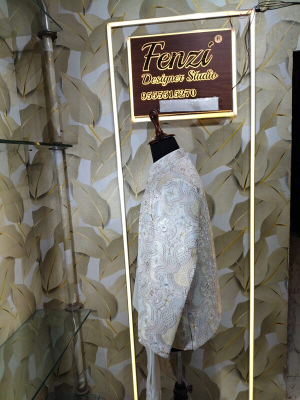 “Elegant ivory embroidered Jodhpuri suit displayed on a mannequin at Fenzi Designer Studio.”