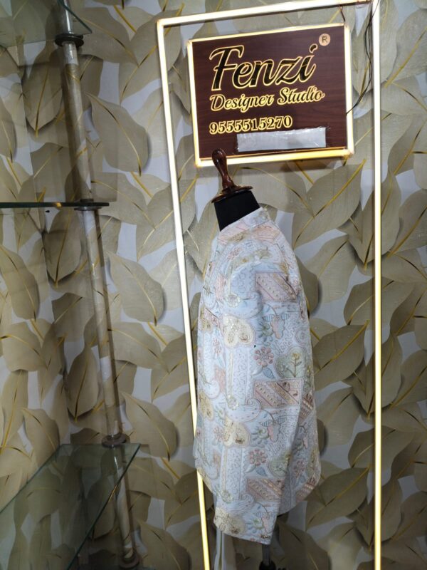 Pastel embroidered Jodhpuri suit displayed on a mannequin at Fenzi Designer Studio