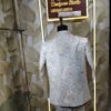 “Elegant ivory embroidered Jodhpuri suit displayed on a mannequin at Fenzi Designer Studio.”
