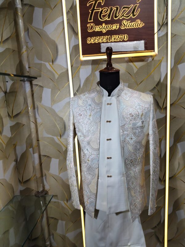 “Elegant ivory embroidered Jodhpuri suit displayed on a mannequin at Fenzi Designer Studio.”