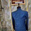 Blue checkered 3-piece men's suit displayed on a mannequin at Fenzi Designer Studio.