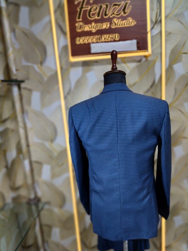 Blue checkered 3-piece men's suit displayed on a mannequin at Fenzi Designer Studio.