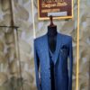 Blue checkered 3-piece men's suit displayed on a mannequin at Fenzi Designer Studio.