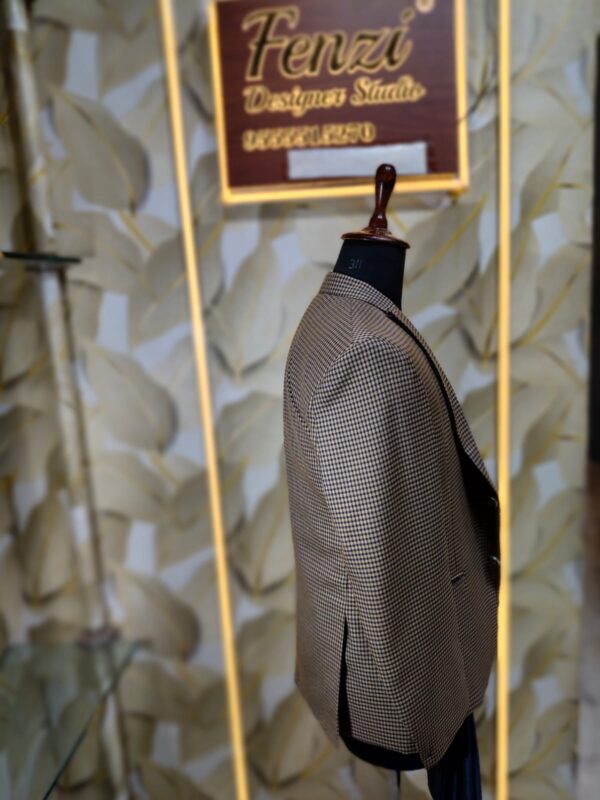 Men’s designer 3-piece suit with a brown micro-check blazer and navy blue waistcoat displayed on a mannequin at Fenzi Designer Studio.”