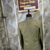 “Three-piece checked suit displayed on a mannequin at Fenzi Designer Studio”