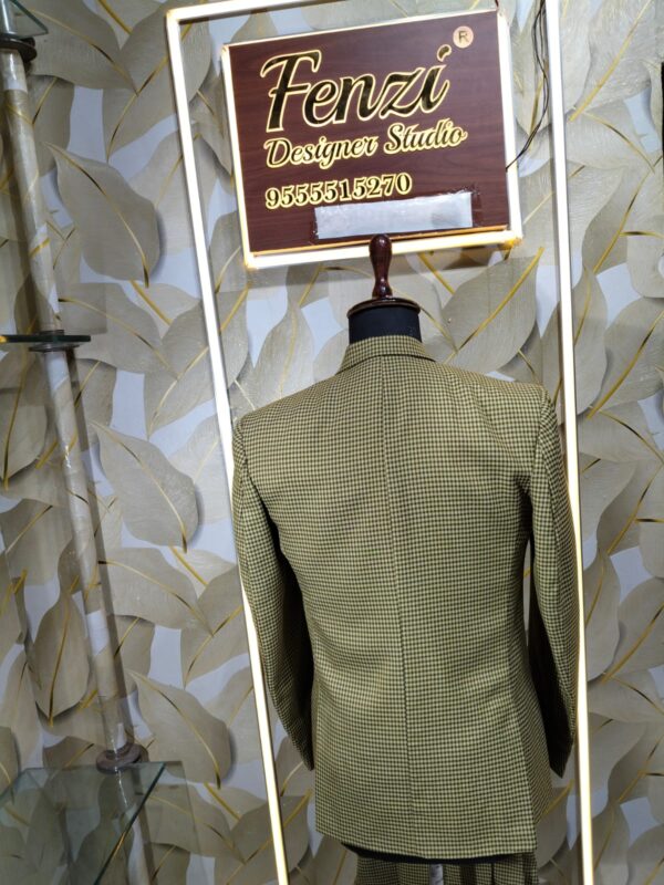 “Three-piece checked suit displayed on a mannequin at Fenzi Designer Studio”
